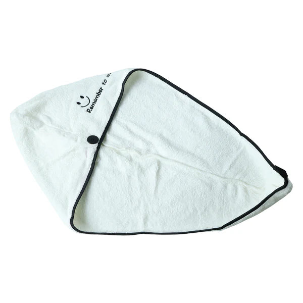 Side profile of woman wearing hair drying towel wrap