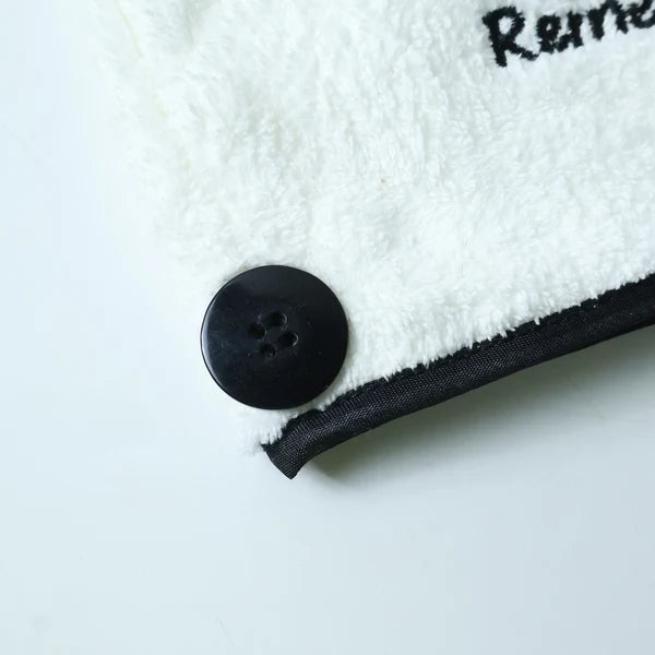 Close-up of button closure on hair towel wrap