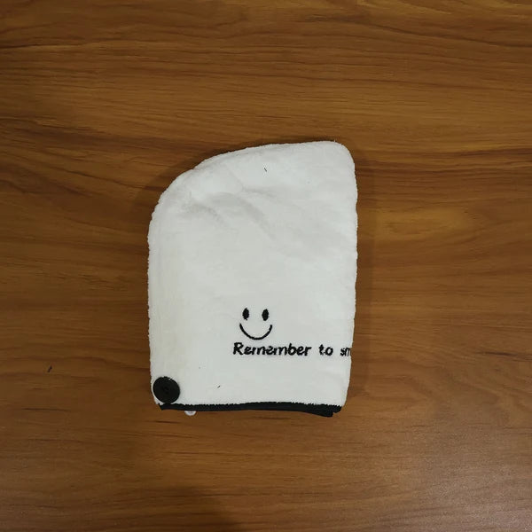 Microfiber Hair Drying Towel Wrap laid flat showing Remember to Smile embroidery